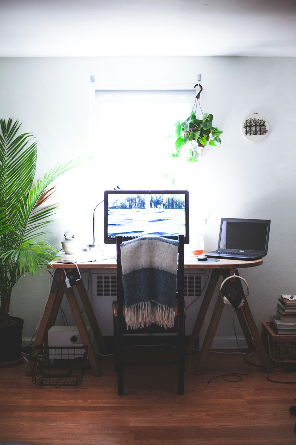 black flat screen computer monitor on brown wooden table