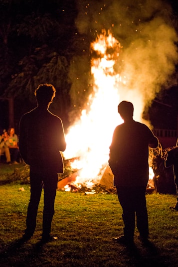 A warm gathering of diverse people sharing stories around a glowing hearth, symbolizing hope and unity.