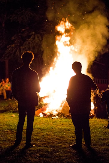 A warm gathering of diverse people sharing stories around a glowing hearth, symbolizing hope and unity.