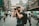 shallow focus photography of man using a DSLR camera