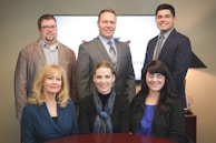 Team of professionals working together in an office setting.
