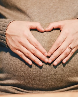 person holding belly photo