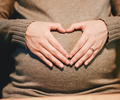 person holding belly photo