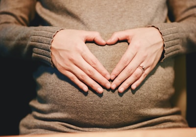 person holding belly photo