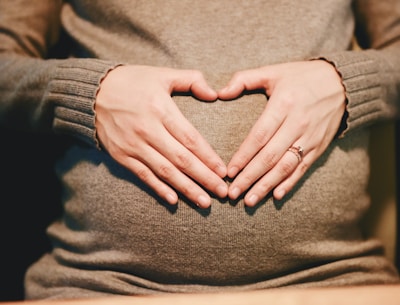 person holding belly photo