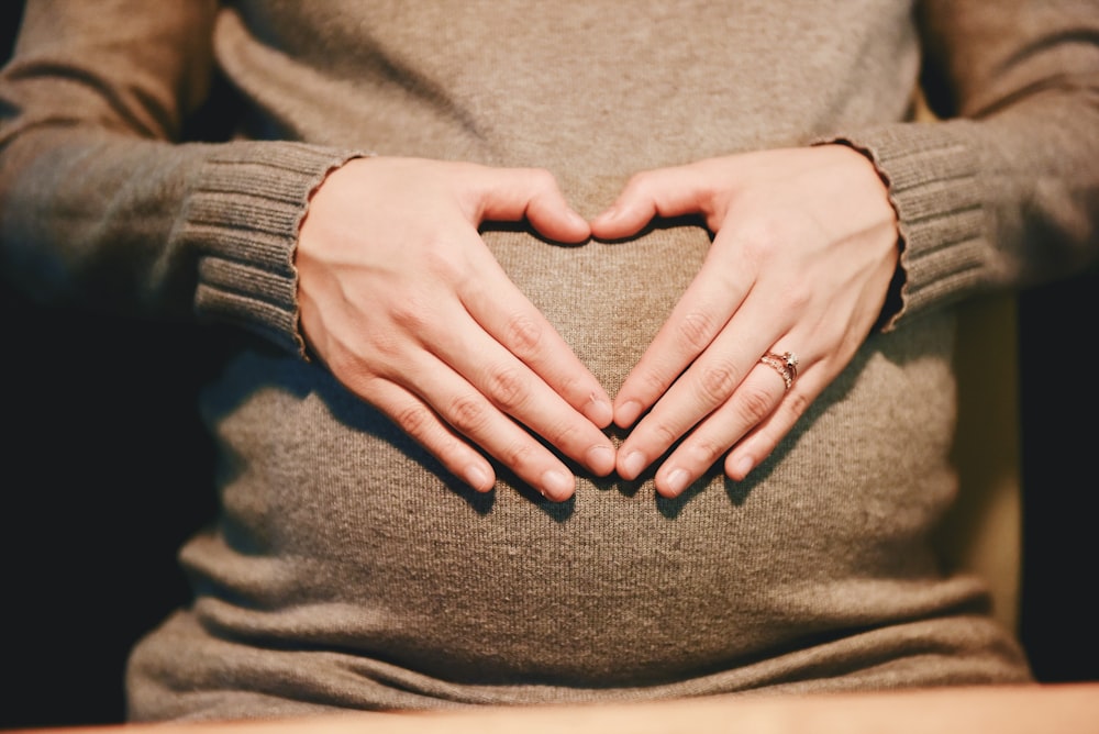 person holding belly photo