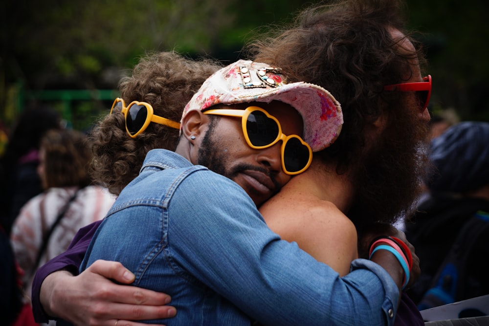 man hugging other man's back