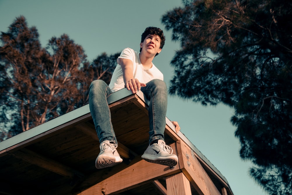 man sitting on roof