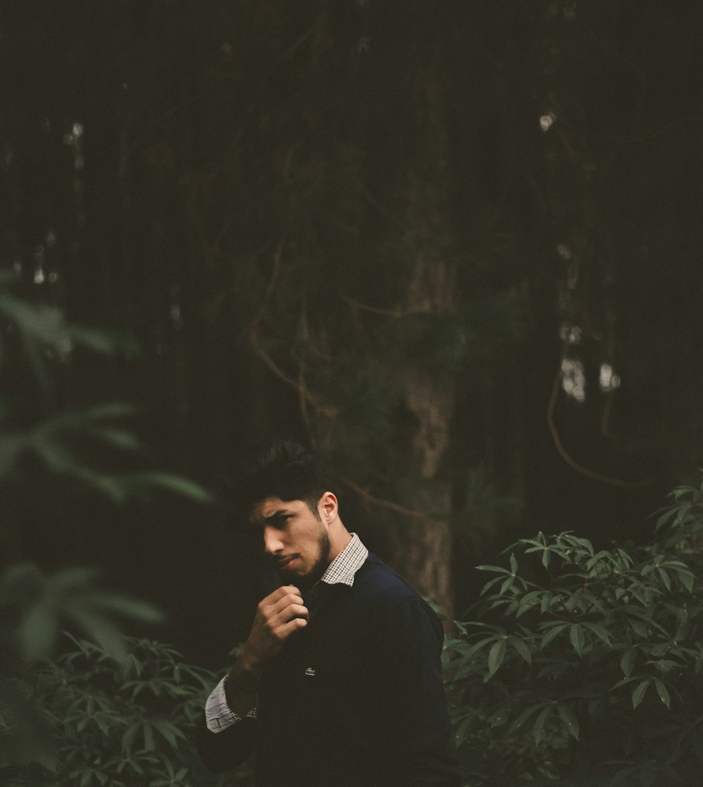 selective photography of man in black top