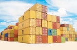 Stacks of colorful shipping containers are arranged neatly under a bright blue sky with scattered white clouds.