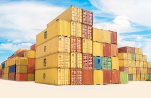 Stacks of colorful shipping containers ready for transport.