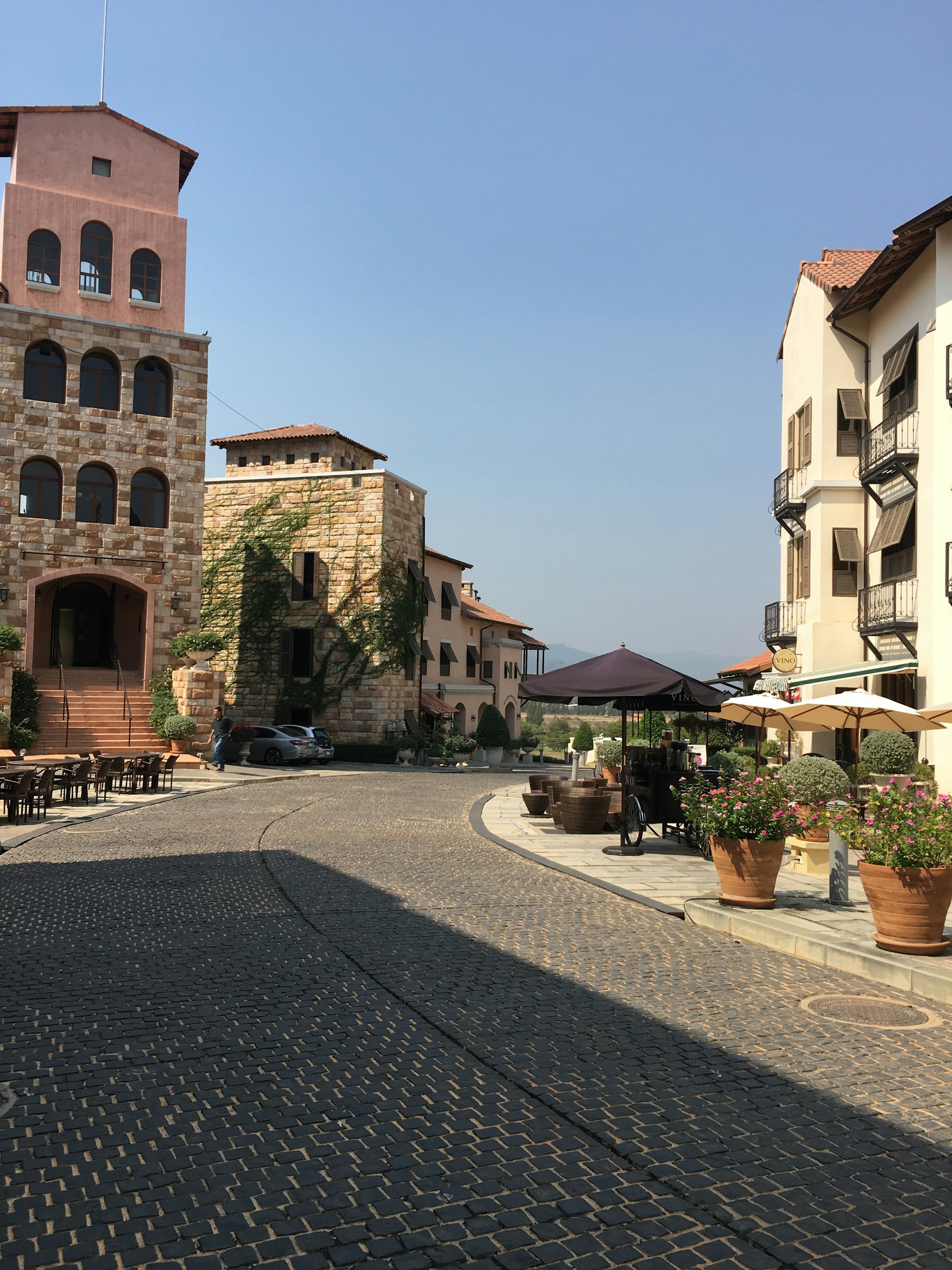 woman wearing yellow long-sleeved dress under white clouds and blue sky during daytime