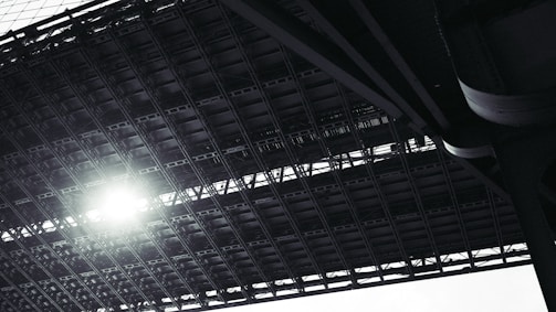 Close-up of a sturdy steel frame structure under bright daylight.