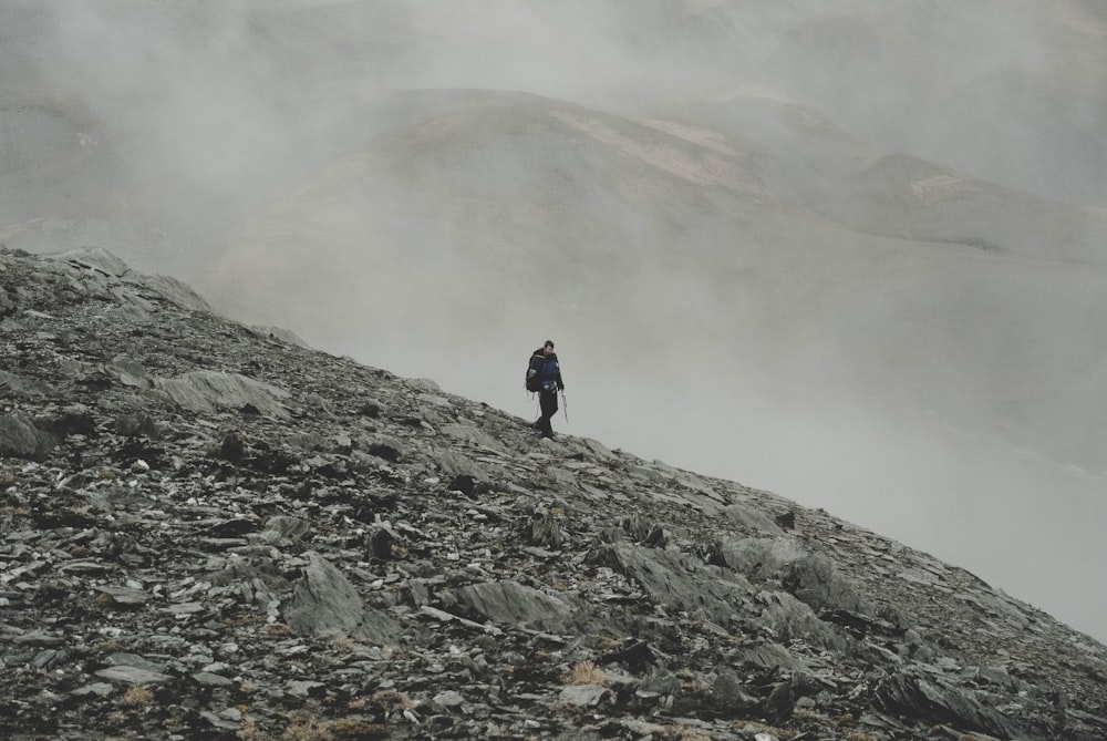 mountaineer climbing down on mountain