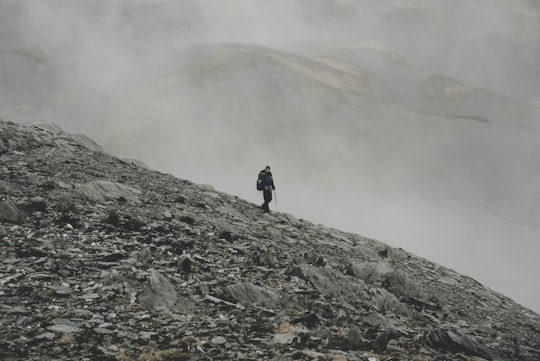 mountaineer climbing down on mountain in Mount Aspiring National Park New Zealand