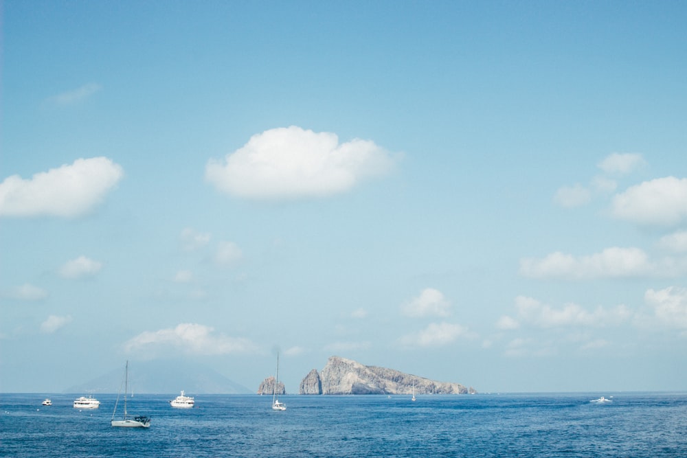 boat on body of water near island