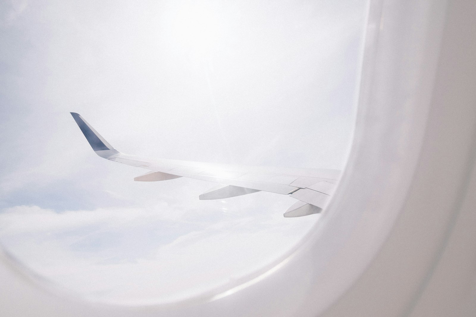 Canon EOS 60D + Canon EF-S 10-18mm F4.5–5.6 IS STM sample photo. Airplane flying over cloud photography