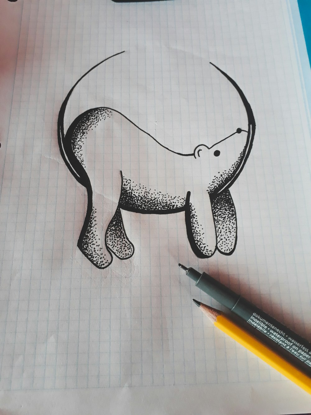 A drawing of a polar bear sitting on a crescent moon.