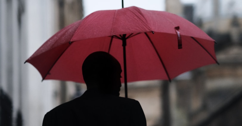 man holding umbrella