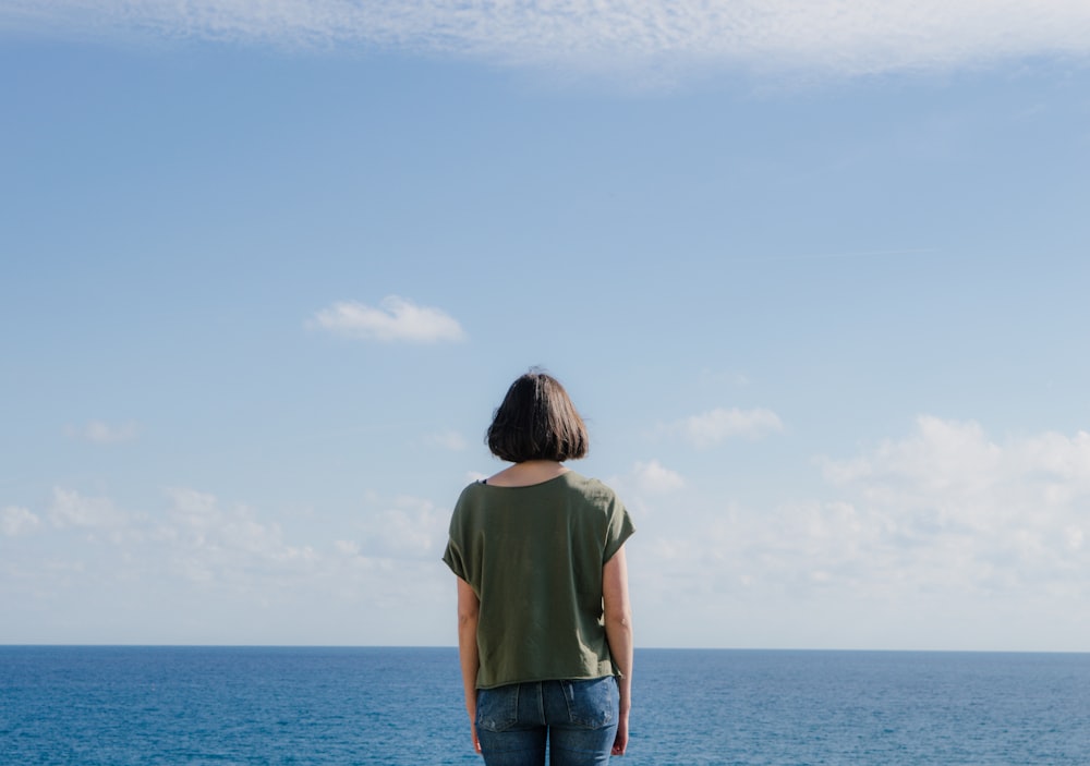 woman standing at beach shore