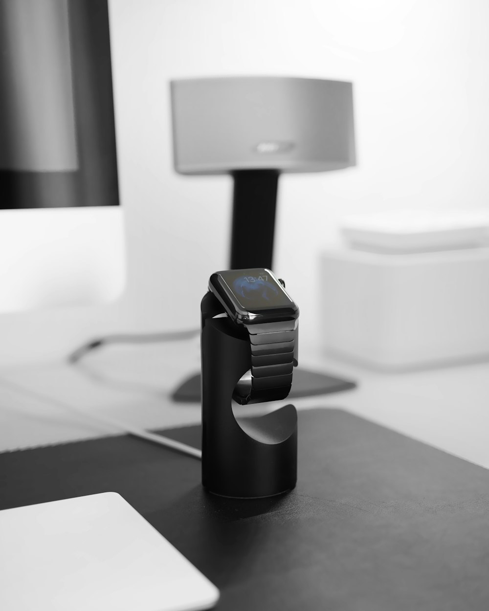 space black case Apple Watch on magnetic charger