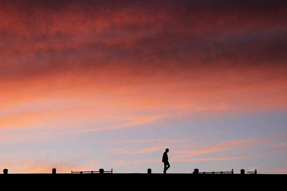 silhouette of man at golden hour