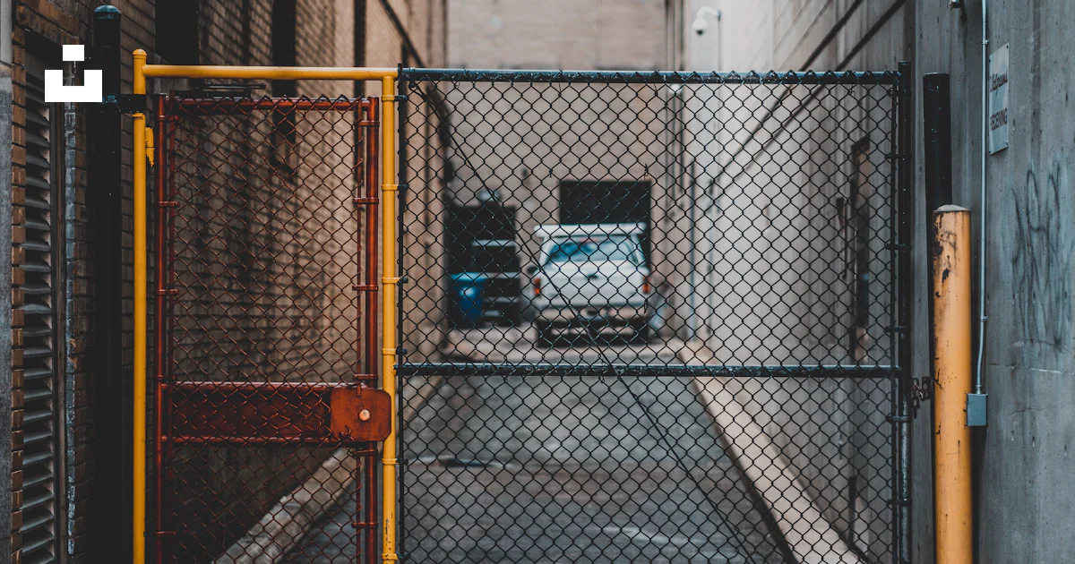Yellow and black cyclone gate photo – Free Fence Image on Unsplash