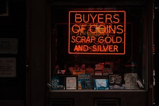 orange buyers of coins scrap gold and silver neon signage