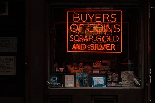 orange buyers of coins scrap gold and silver neon signage