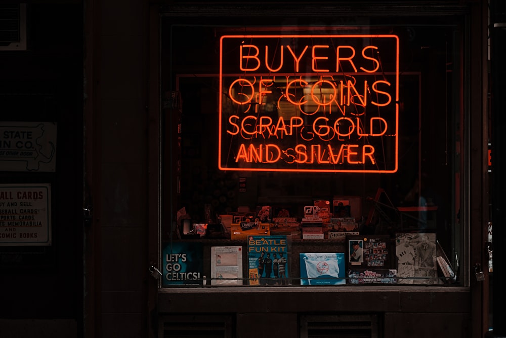 orange buyers of coins scrap gold and silver neon signage