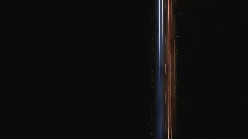a tall metal pole in the middle of a dark room