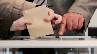 person standing near table