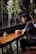 woman sitting on brown wooden chair