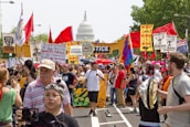 Youth activists holding signs advocating for climate justice at a vibrant rally.