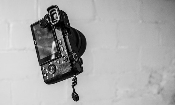 black MILC on grey wall