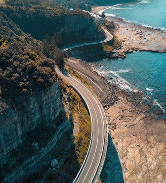 birds eye view of highway beside bay