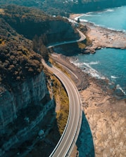 birds eye view of highway beside bay