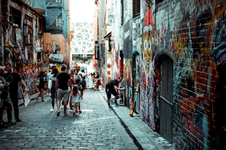 man and girl walking beside building