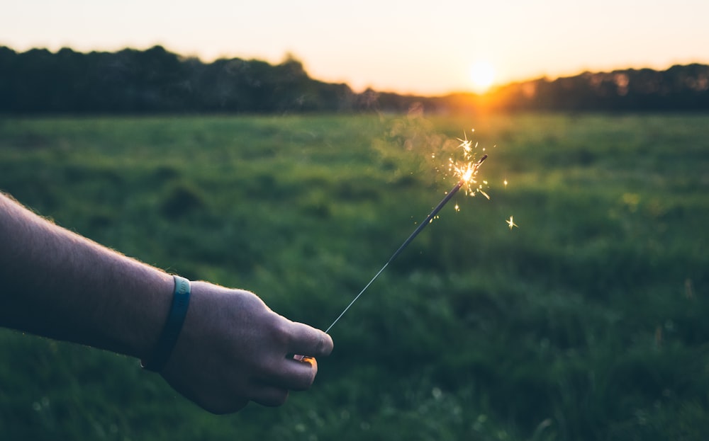 person holding fire stick