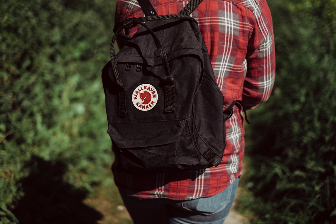 person wearing black backpack