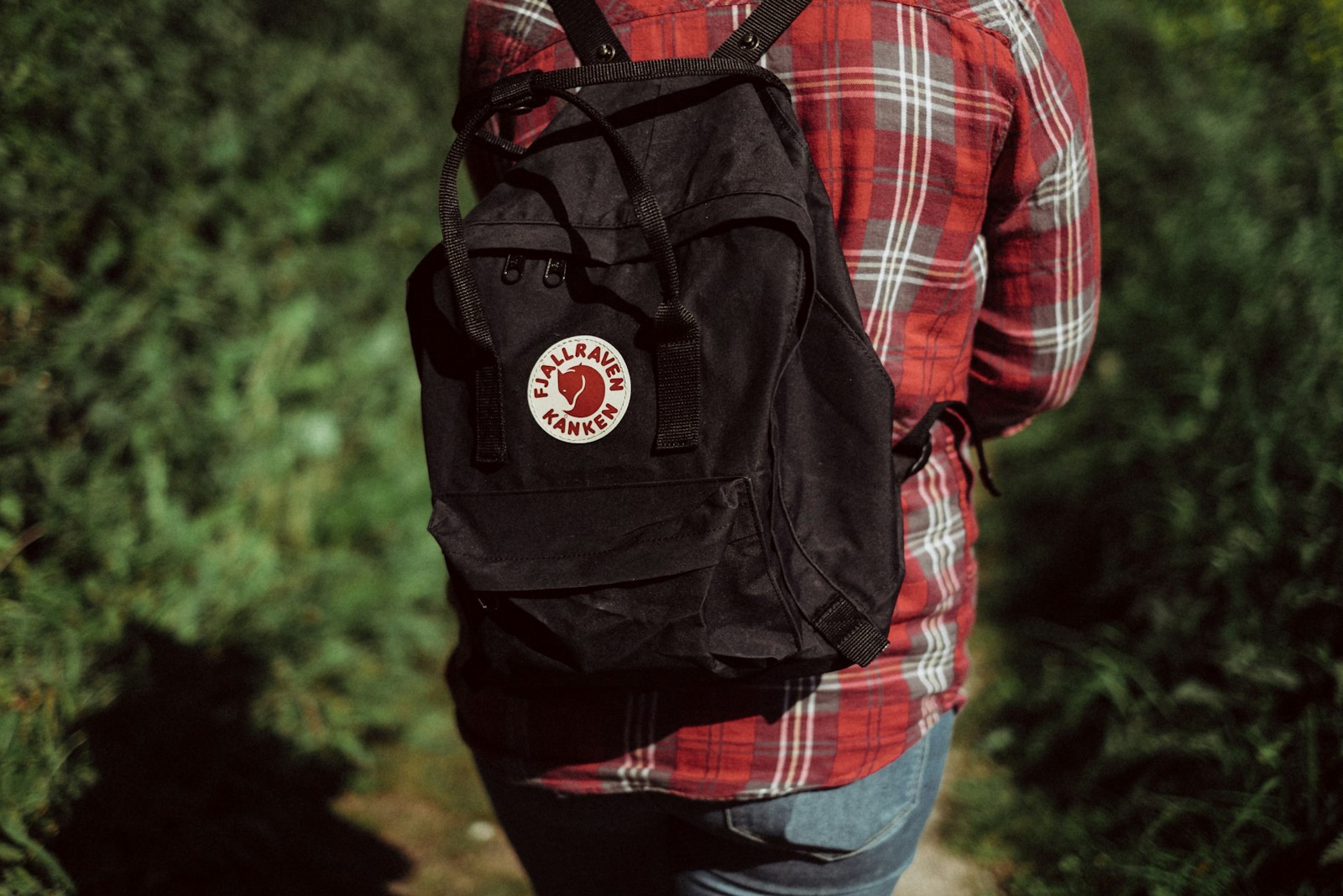 Fujifilm X-E2 + Fujifilm XF 35mm F1.4 R sample photo. Person wearing black backpack photography