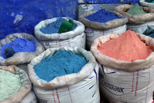 Close-up of large sacks filled with natural herbal powders ready for shipment in a clean warehouse.