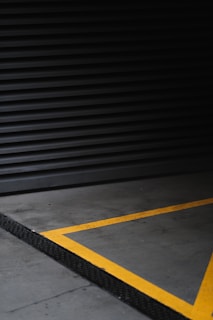 gray and yellow concrete flooring temporary lines