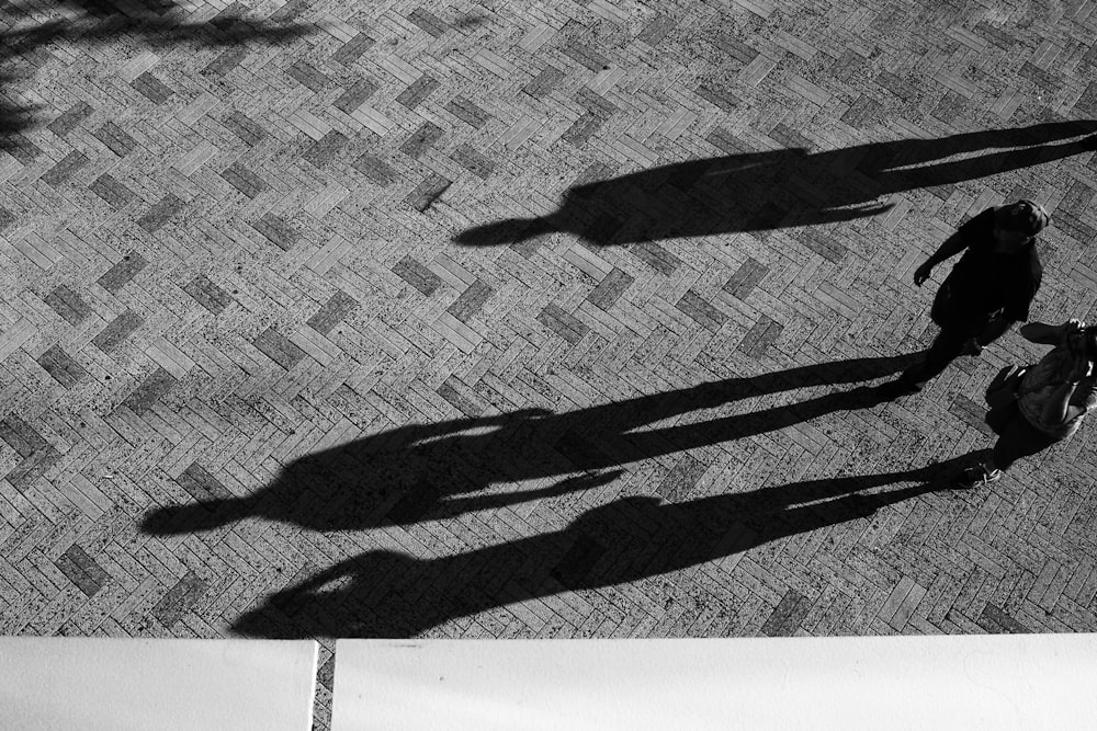 two people standing on concrete floor