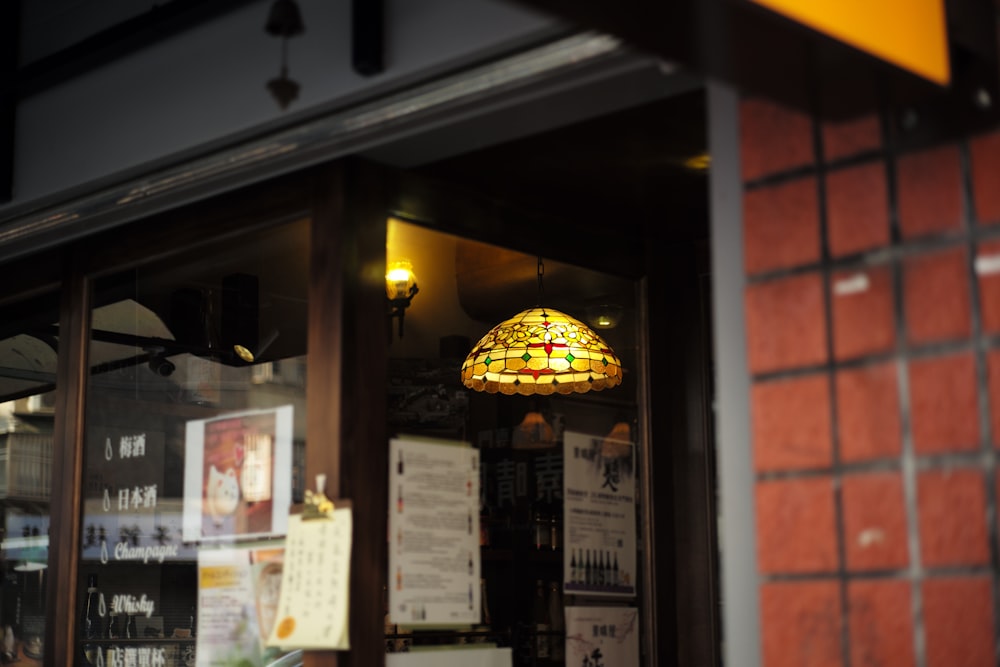 a lamp hanging from the side of a building