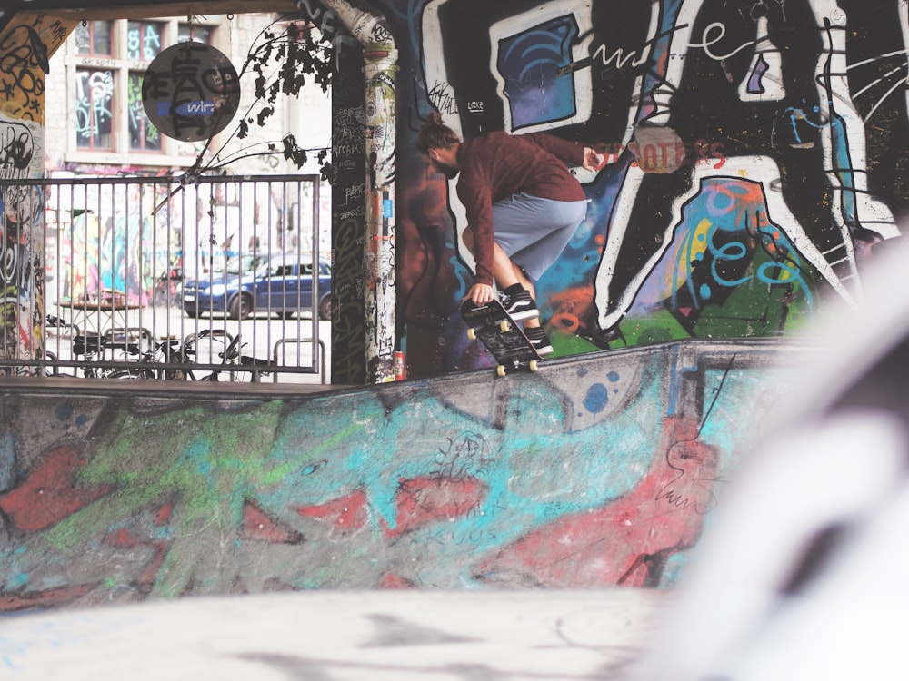 man skateboarding in skate park