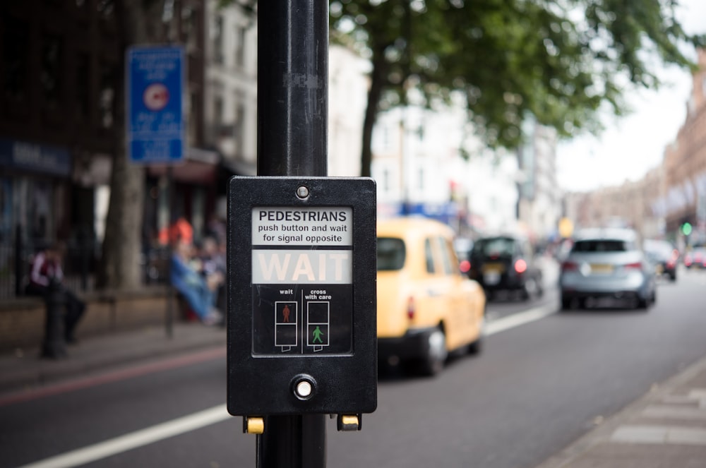 pedestrian signage displaying wait