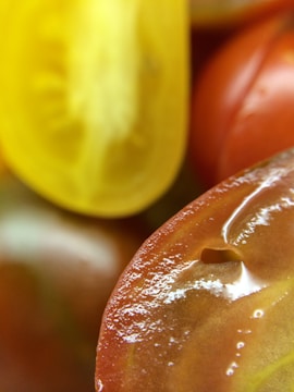 Close-up image of tomatoes being processed in the factory