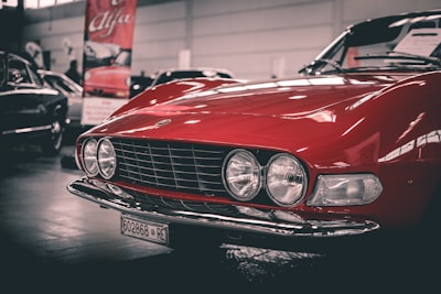 shallow focus photo of red car