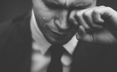 man wiping his tears sorrow zoom background